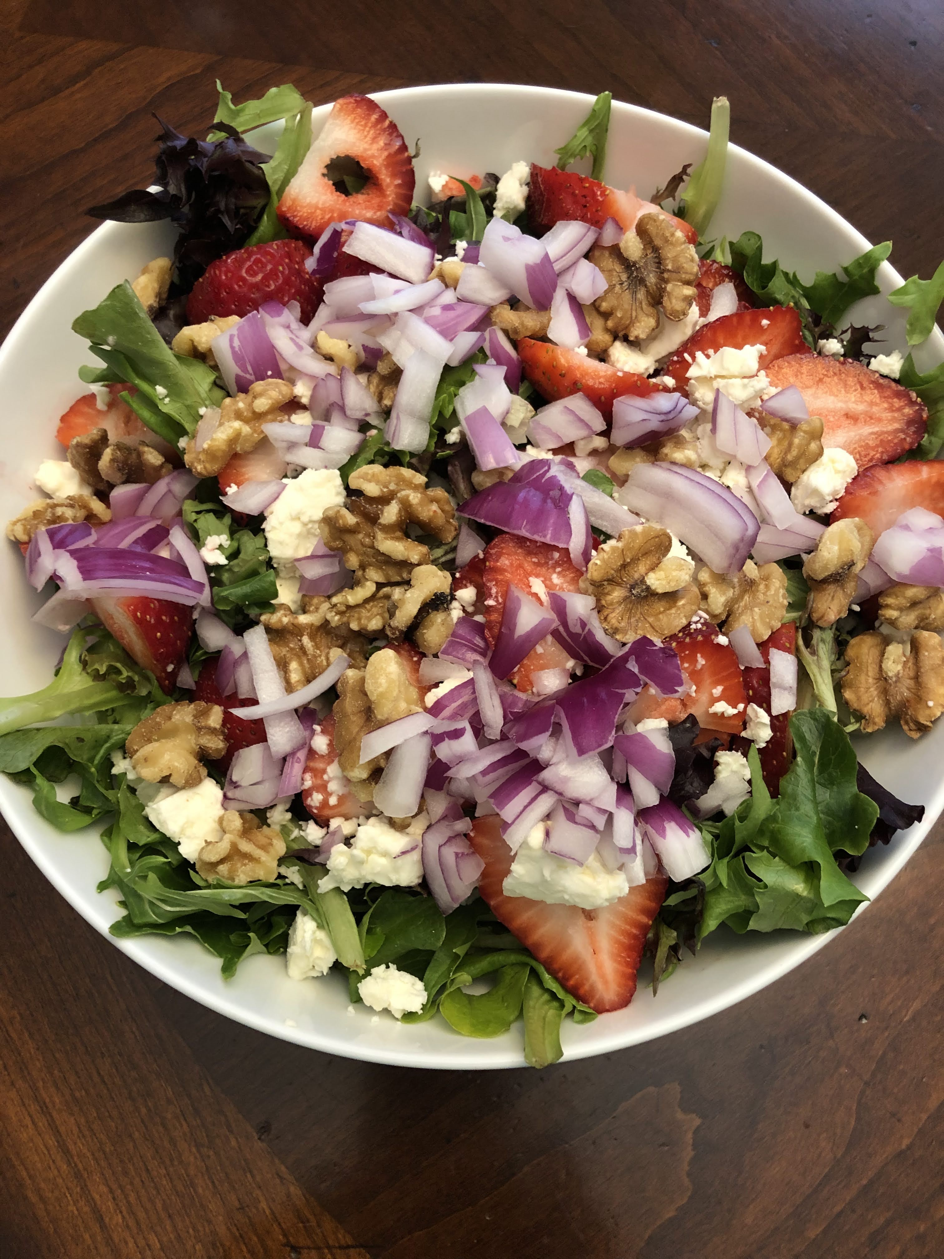 Strawberry salad with feta cheese and walnuts
